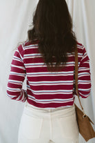 Model is wearing striped long sleeve round neck t-shirt 