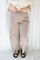 Model wearing the stripe pocket detail wide leg pants. 