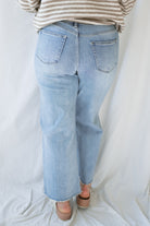 Back  view of model wearing the Piper medium wash denim.