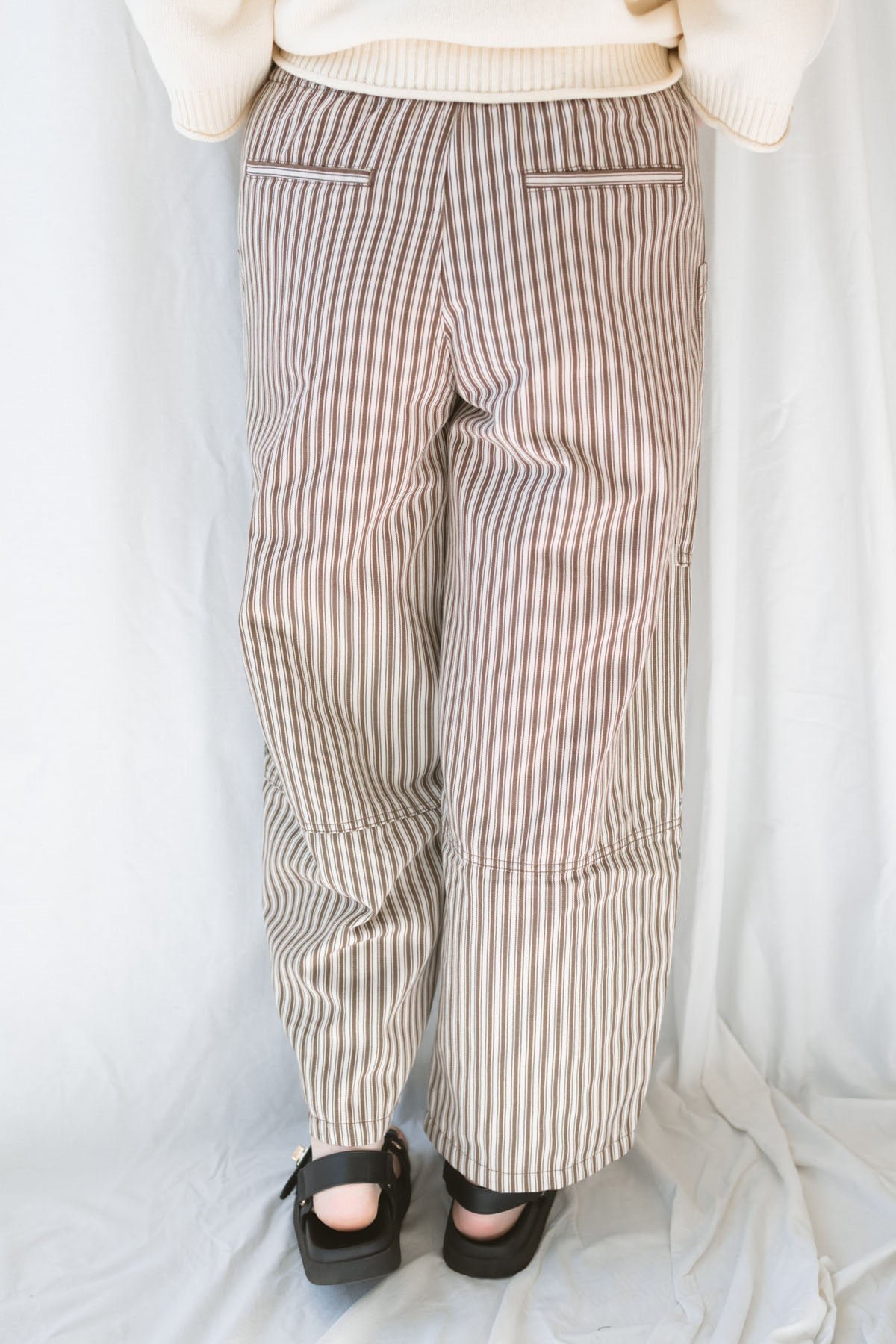 Model wearing the stripe pocket detail wide leg pants. 