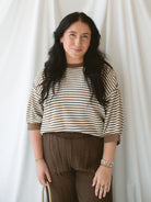 Model wearing the amora stripe short sleeve top.
