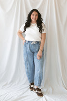 Model wearing round neck short sleeve top.