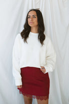 Model wearing balloon sleeve detail sweatshirt. 