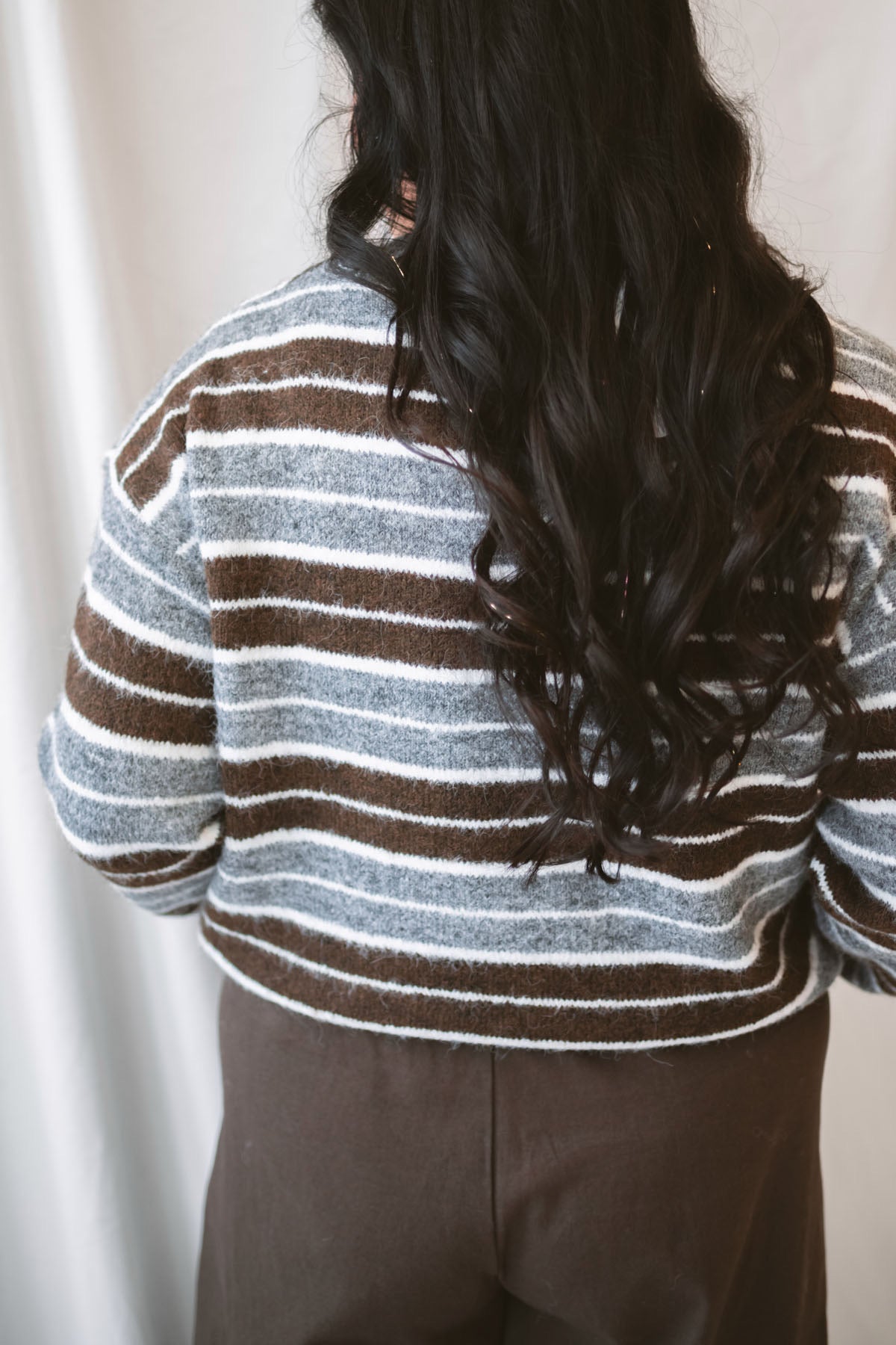 Abbie Striped Crew Neckline Long Sleeve Cropped Knit Sweater in Brown Multi with a warm neutral stripe pattern.