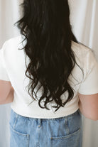 Model wearing round neck short sleeve top.