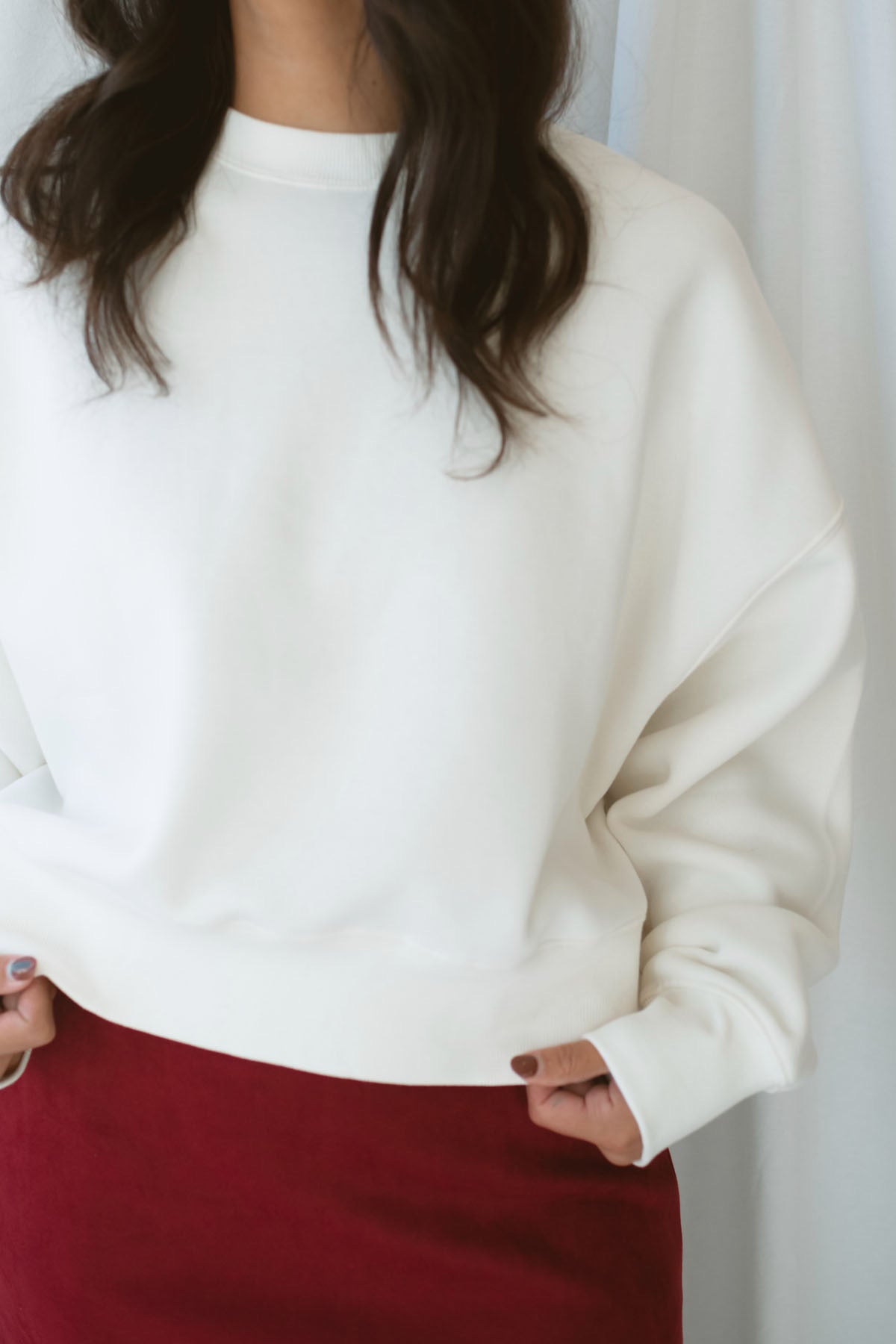 Model wearing balloon sleeve detail sweatshirt. 
