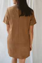 Model wearing the faux suede mini t-shirt style dress. A casual option that can be dressed up with boots and jewelry. 
