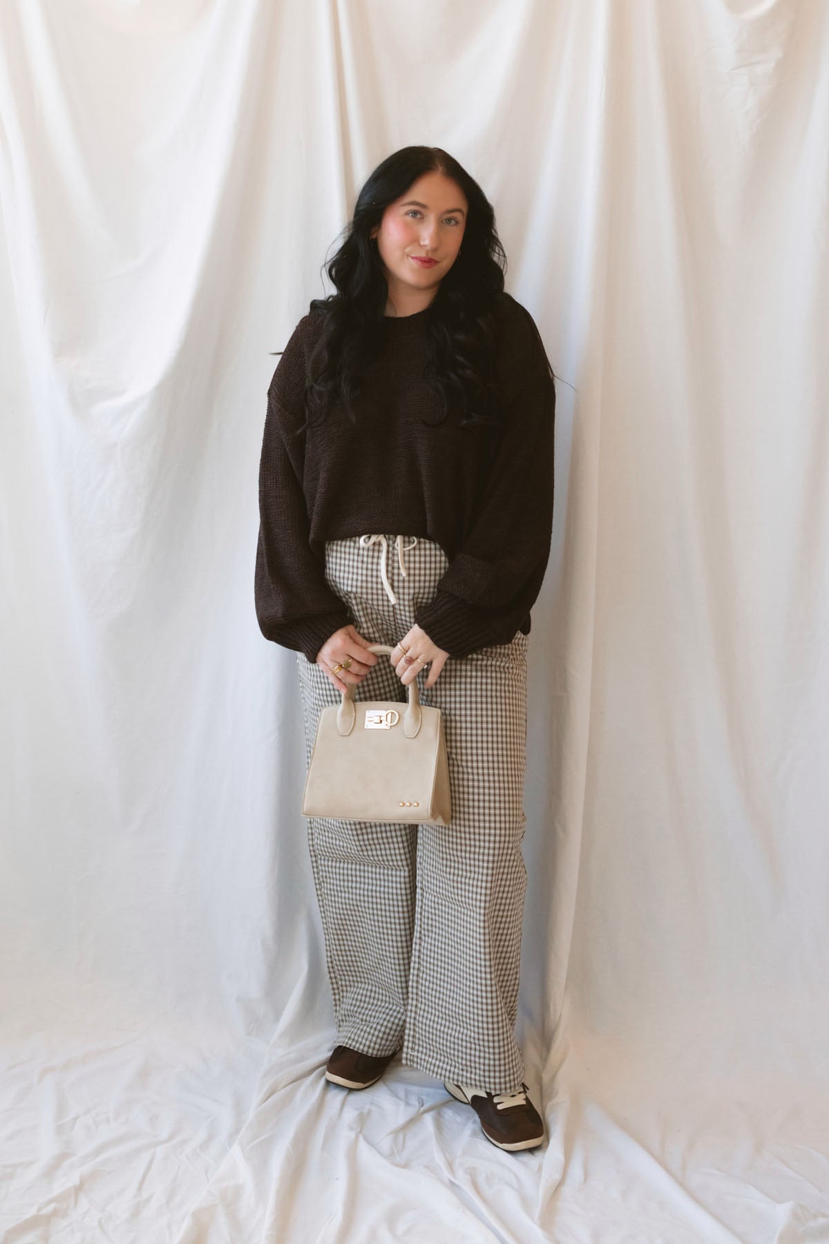 Teddi dark brown oversized sweater featuring a relaxed silhouette and statement balloon sleeves.