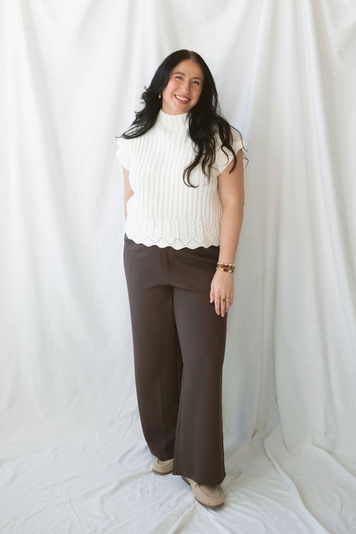 Rory Ivory short sleeve turtleneck sweater vest for women, featuring a creamy neutral knit design and cozy high neckline for casual fall outfits.