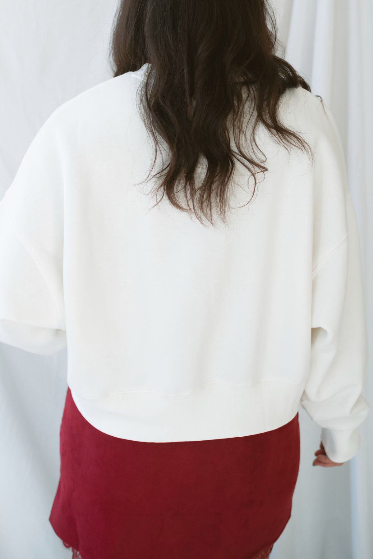 Model wearing balloon sleeve detail sweatshirt. 