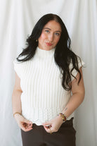 Rory Ivory short sleeve turtleneck sweater vest for women, featuring a creamy neutral knit design and cozy high neckline for casual fall outfits.