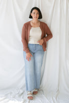 Model is wearing the ribbed edge open cardigan. Paired with a basic cream tank and a pair of denim. This cardigan is great from season to season. 