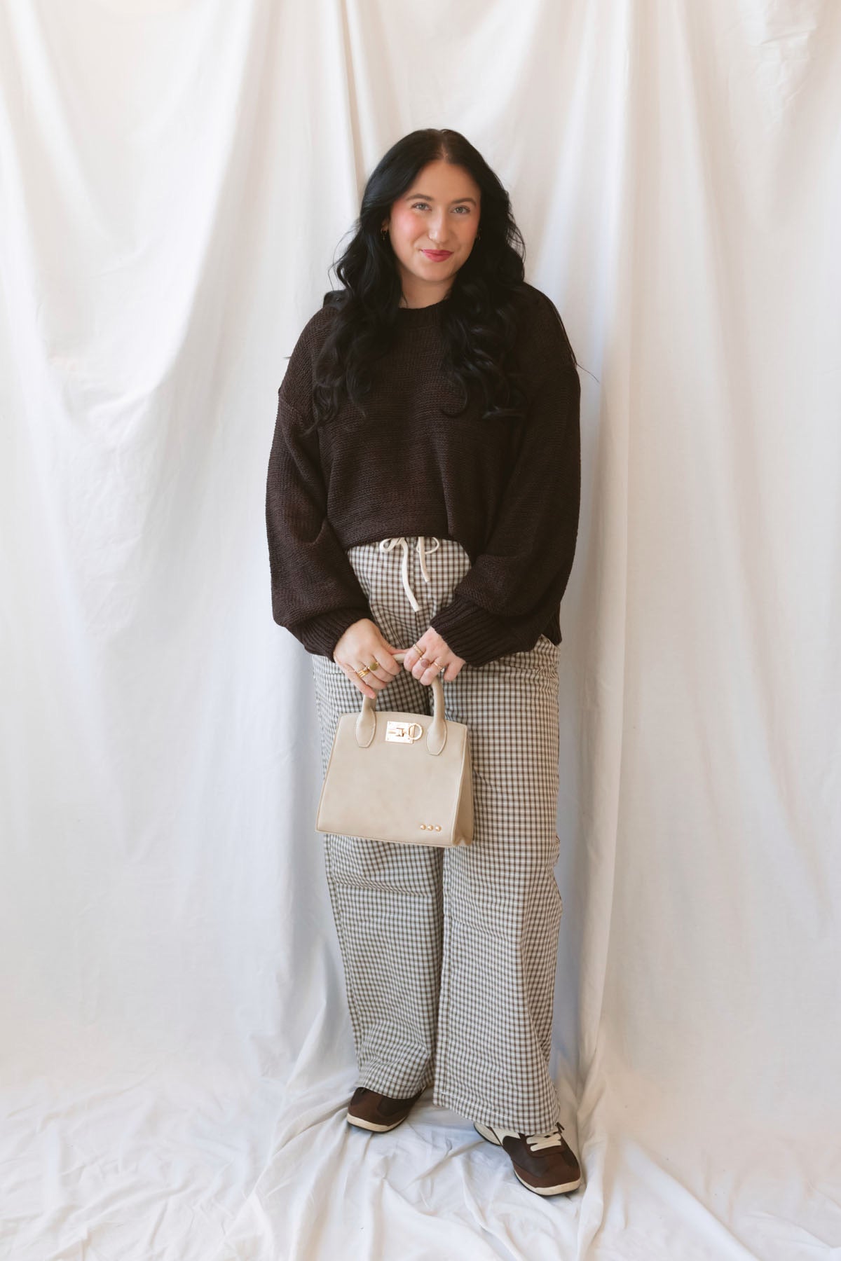 Avery brown and off-white checkered loose fit pants with an adjustable tie-front waist.