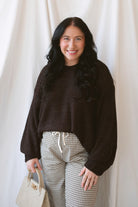 Teddi dark brown oversized sweater featuring a relaxed silhouette and statement balloon sleeves.
