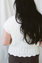 Rory Ivory short sleeve turtleneck sweater vest for women, featuring a creamy neutral knit design and cozy high neckline for casual fall outfits.