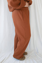 Model wearing the fleece straight leg sweatpants with elastic waistband. 