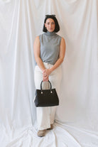 Kori Sleeveless Turtle Neck Soft Knit Top in Grey featuring a sleeveless silhouette and classic turtle neckline.