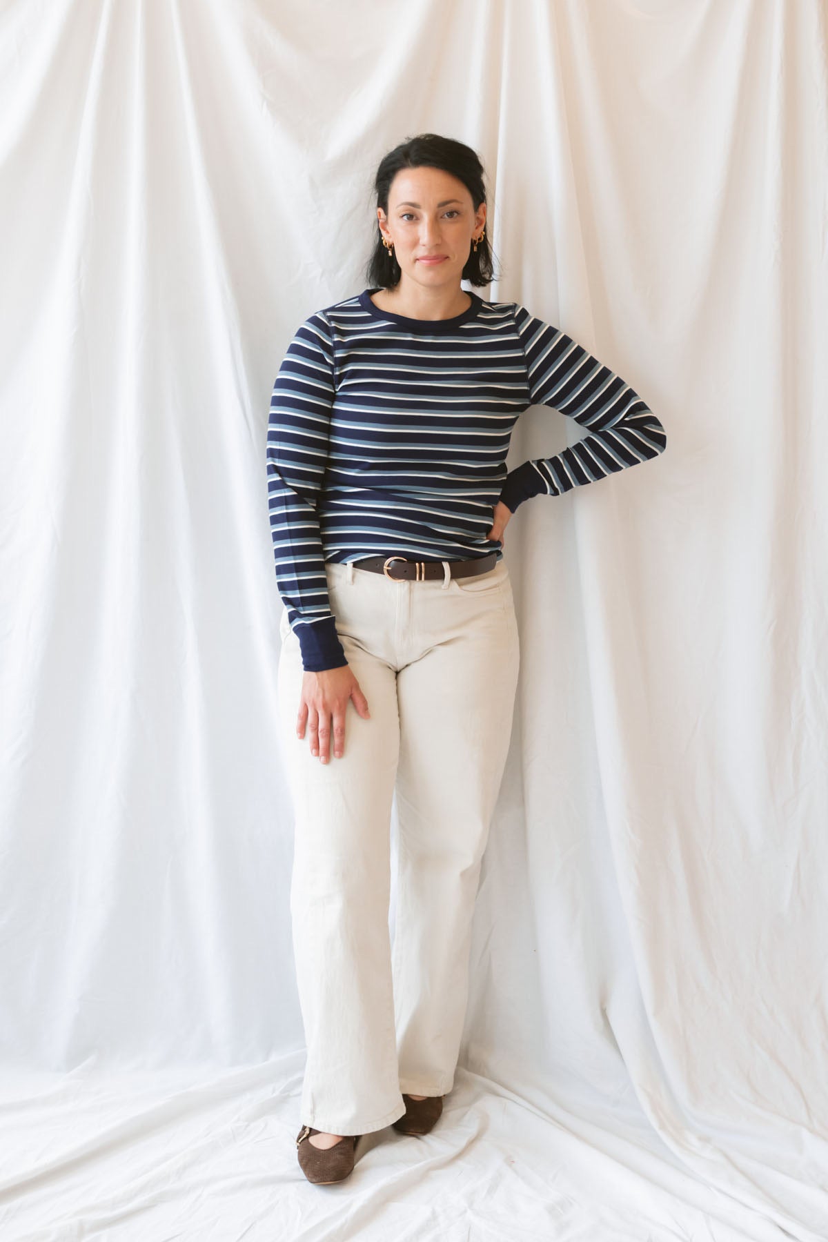 Model wearing the stripe long sleeve top in dark navy.