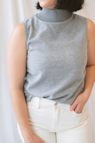 Kori Sleeveless Turtle Neck Soft Knit Top in Grey featuring a sleeveless silhouette and classic turtle neckline.