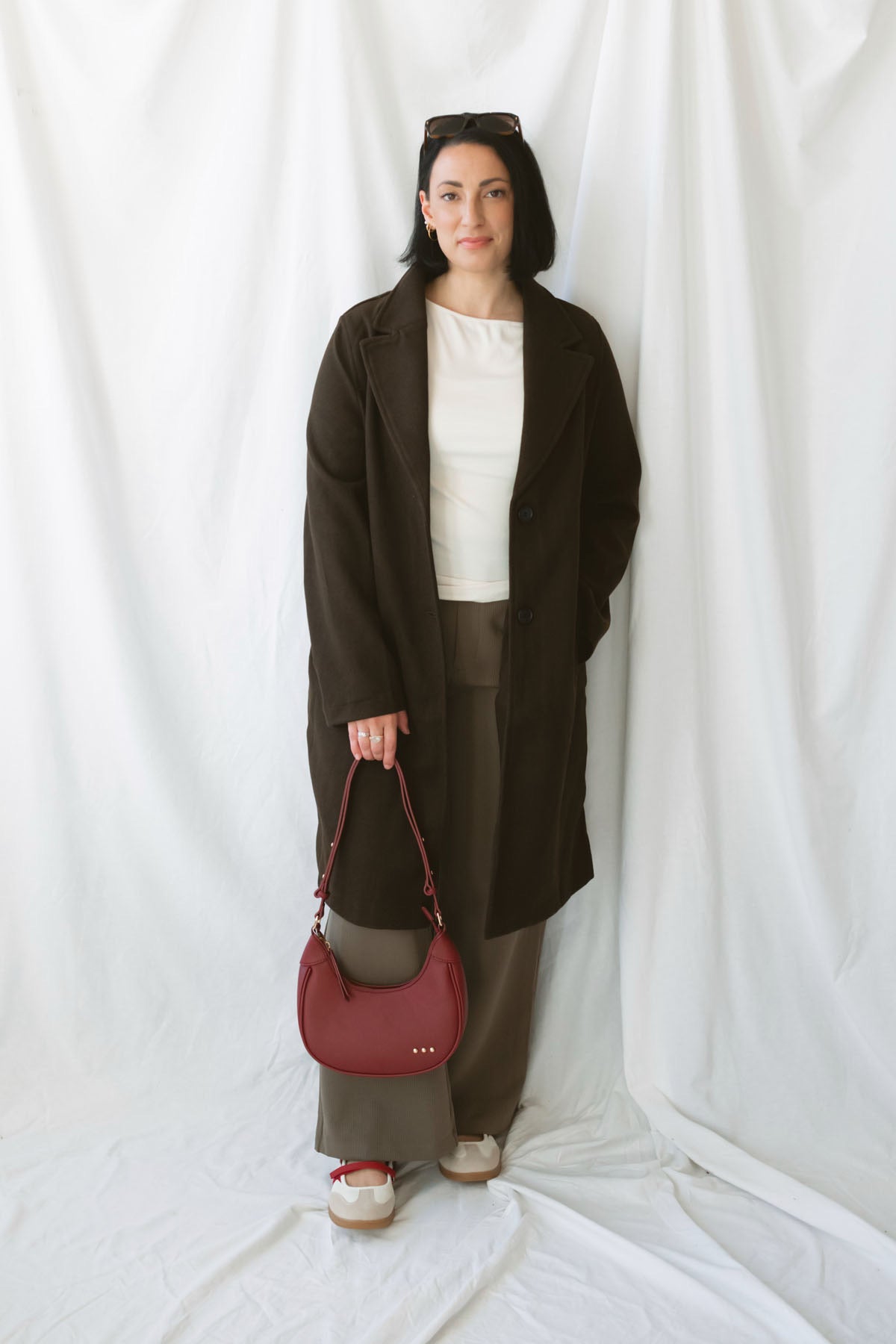 Carrie women's soft long coat in Brown featuring a classic extended-length silhouette and long sleeves for stylish fall and winter layering.