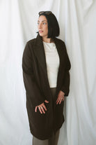 Carrie women's soft long coat in Brown featuring a classic extended-length silhouette and long sleeves for stylish fall and winter layering.