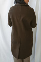Carrie women's soft long coat in Brown featuring a classic extended-length silhouette and long sleeves for stylish fall and winter layering.