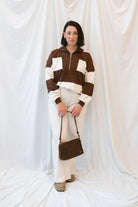 Model wearing half zip pullover sweatshirt. 