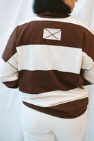 Model wearing half zip pullover sweatshirt. 