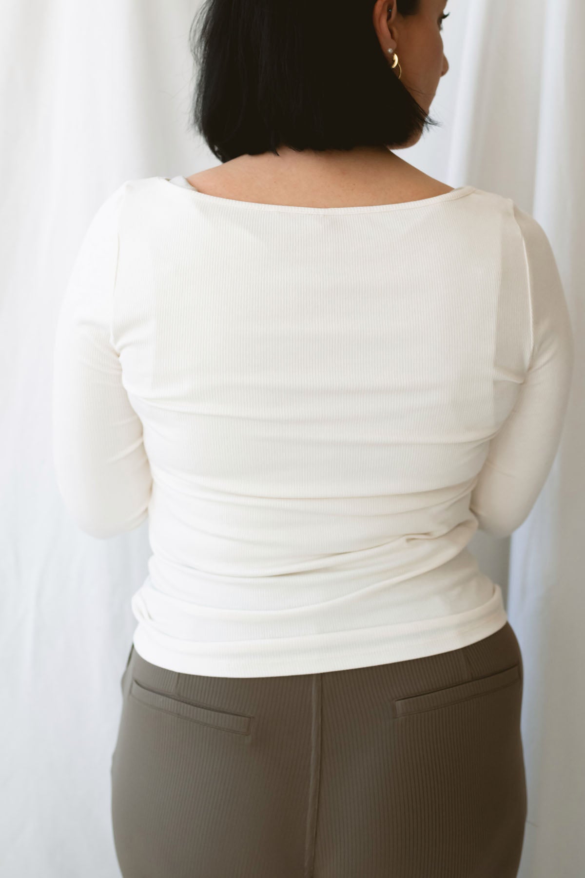 Brynley women's Vanilla micro ribbed long sleeve top featuring a feminine boat neckline and soft cream color for casual everyday styling.
