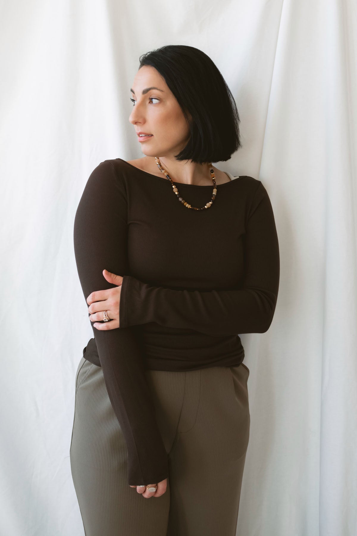 Brynley Boat Neck Micro Ribbed Top in Coffee Bean brown, featuring a feminine boat neckline, subtle ribbed texture, and long sleeves for women's everyday outfits.