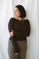 Brynley Boat Neck Micro Ribbed Top in Coffee Bean brown, featuring a feminine boat neckline, subtle ribbed texture, and long sleeves for women's everyday outfits.