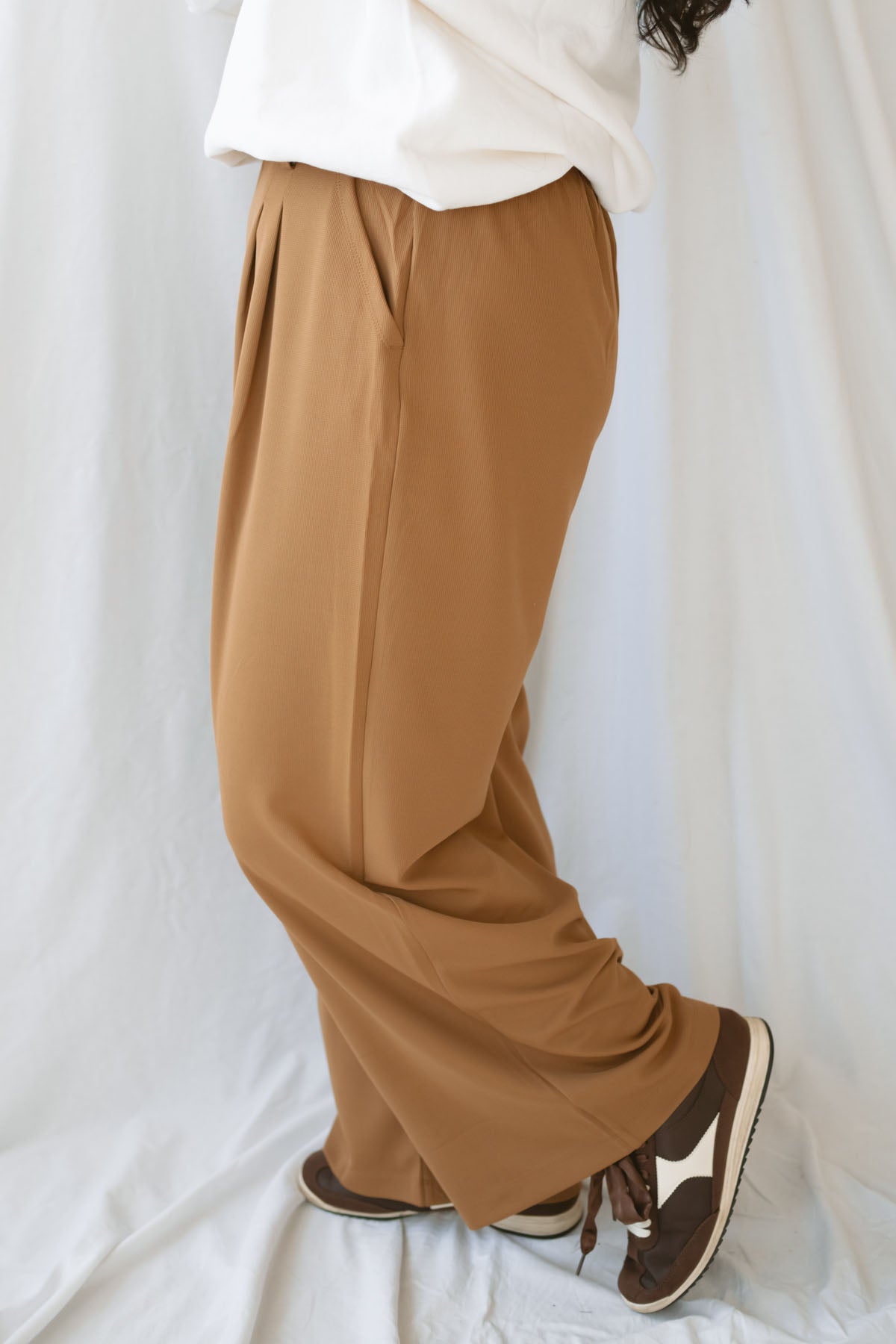 Model wearing the wide leg micro waffle textured pants. 