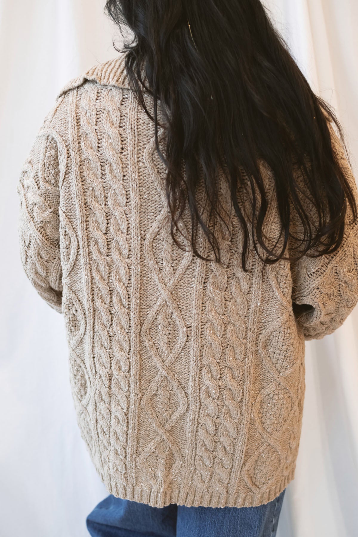 Beige oversized cable knit cardigan for women featuring a collared neckline, textured knit design, and relaxed fit.