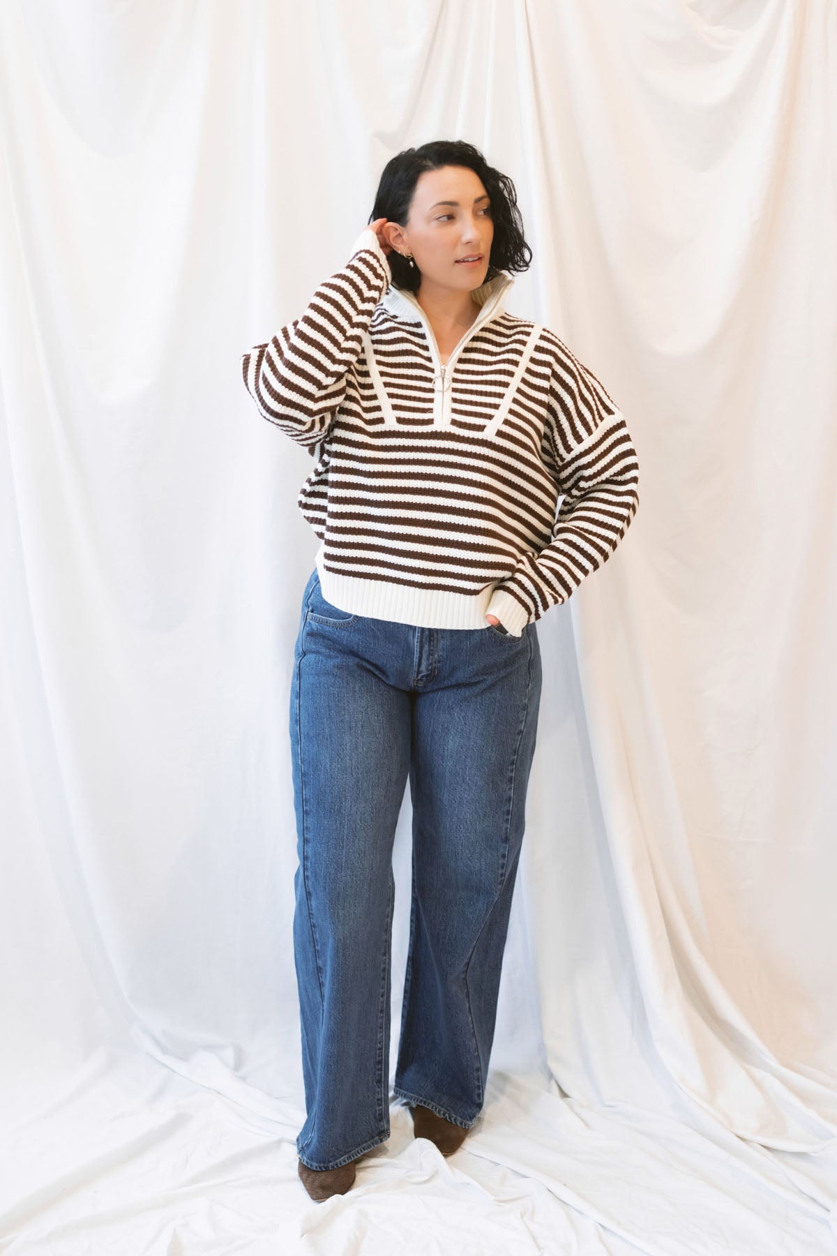 Brown striped half-zip sweater for women featuring a preppy-inspired design, classic stripe pattern, and comfortable knit silhouette for fall and winter outfits.