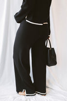 Laura Black Contrast Stripe Trim Collar Knit Sweater and Pants Set featuring a collared sweater and coordinating knit pants with contrasting stripe details.