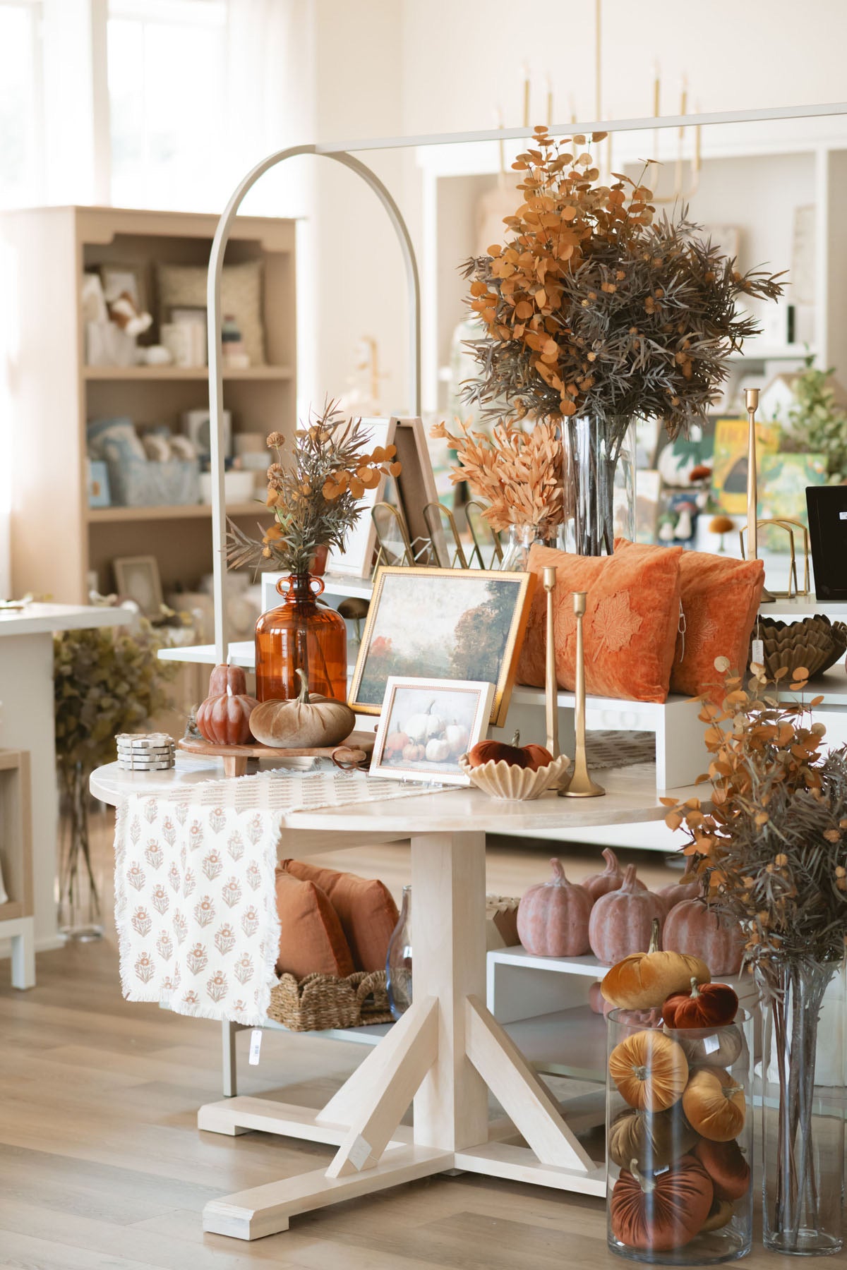 Yellow two tone faux eucalyptus stem styled with the light brown thistle spray and other warm autumn decor.