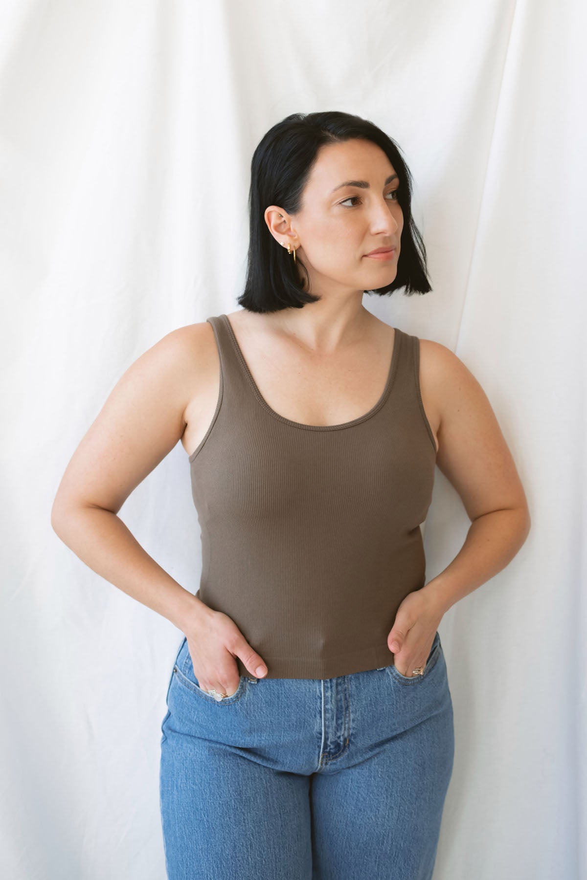 Trina Classic Seamless Ribbed Tank Top in Truffle, a women's sleeveless ribbed basic featuring a smooth seamless design and rich earthy neutral color.
