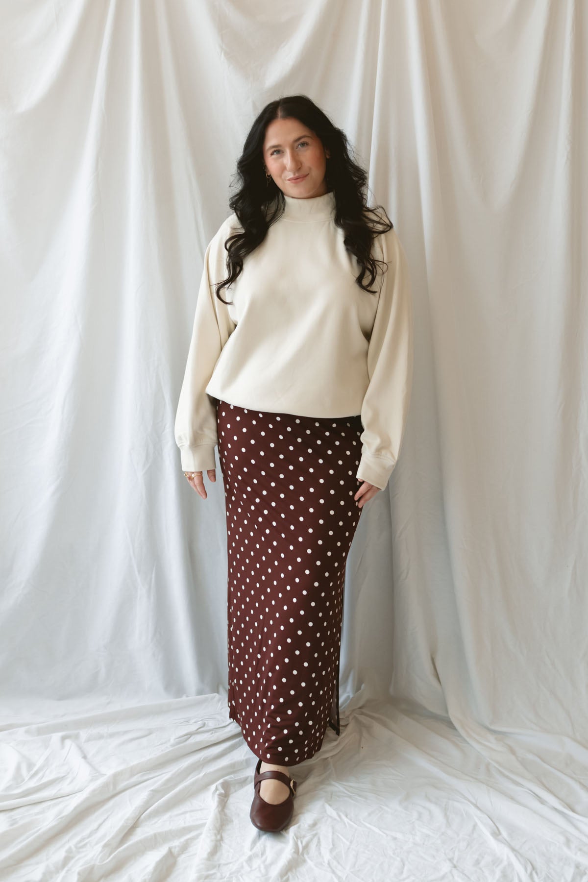 Model wearing the double brushed mock neck pullover. 