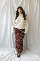 Model wearing the double brushed mock neck pullover. 