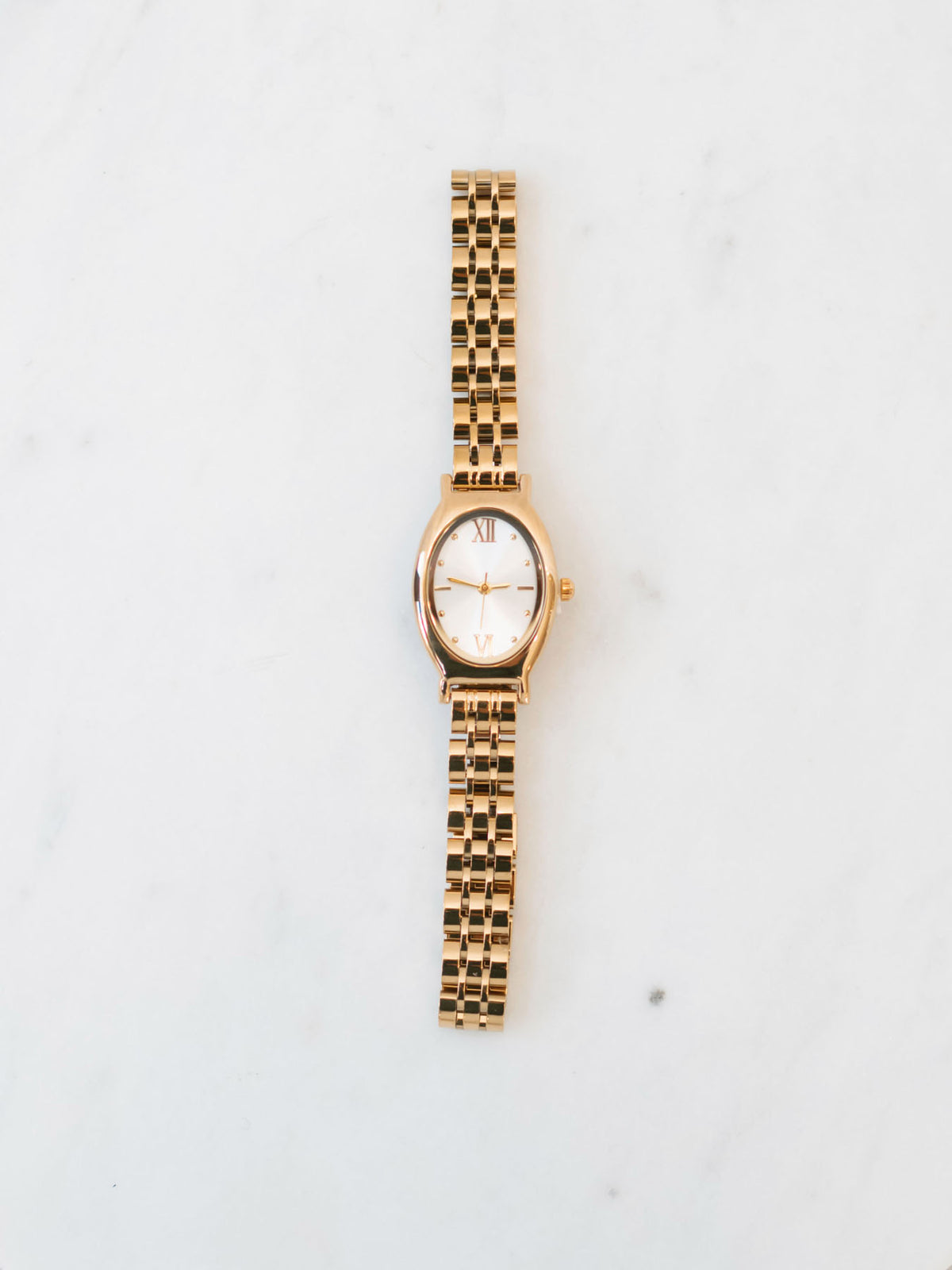 Gold round face watch 