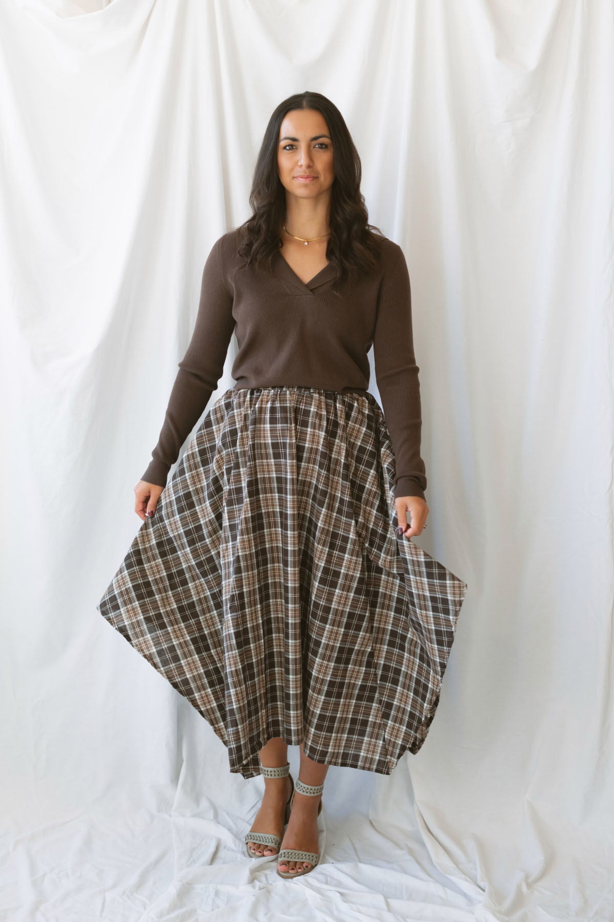Ronny chocolate brown long sleeve ribbed knit top with an open collar neckline.