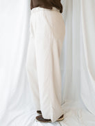 Model wearing wide leg trousers with drawstring waistband