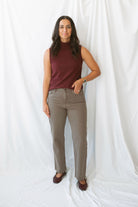 Model wearing the straight leg denim in brown.