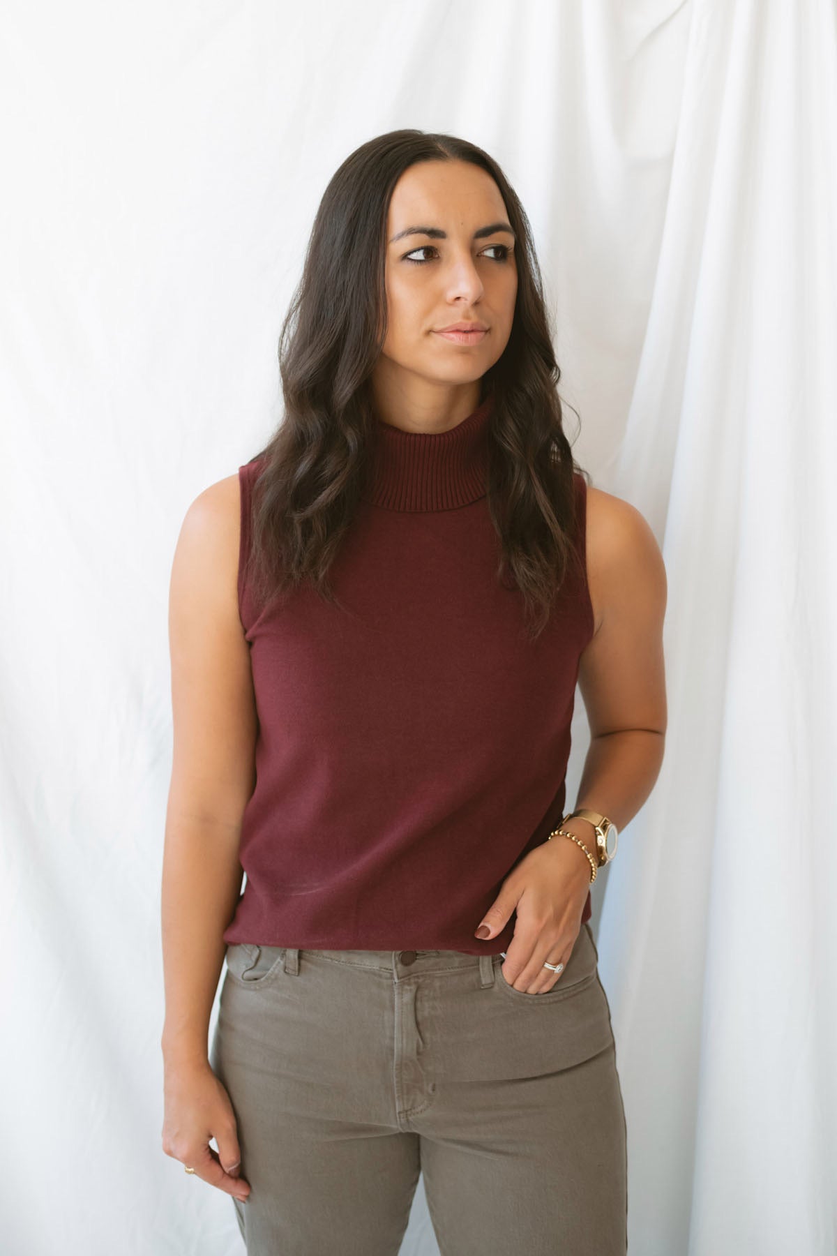 Kori Sleeveless Turtle Neck Soft Knit Top in Maroon featuring a sleeveless silhouette and classic turtle neckline.