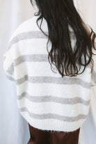 Cream fuzzy knit sweater for women featuring a classic striped pattern, relaxed boyfriend fit, and cozy textured finish for casual fall and winter styling.