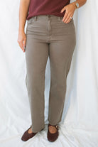 Model wearing the straight leg denim in brown.