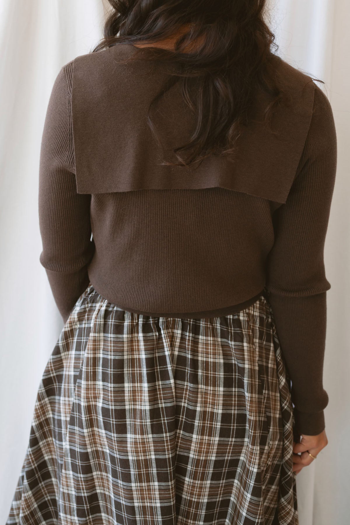 Ronny chocolate brown long sleeve ribbed knit top with an open collar neckline.