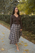 Ronny chocolate brown long sleeve ribbed knit top with an open collar neckline.