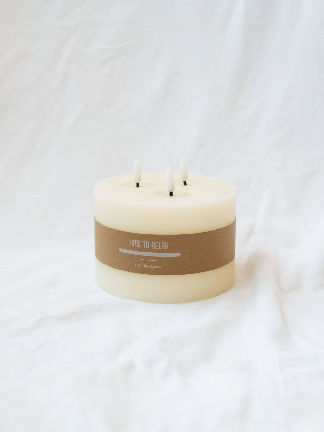 3 Wick LED candle with life like melted spots under "flame". 