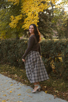 Ronny chocolate brown long sleeve ribbed knit top with an open collar neckline.